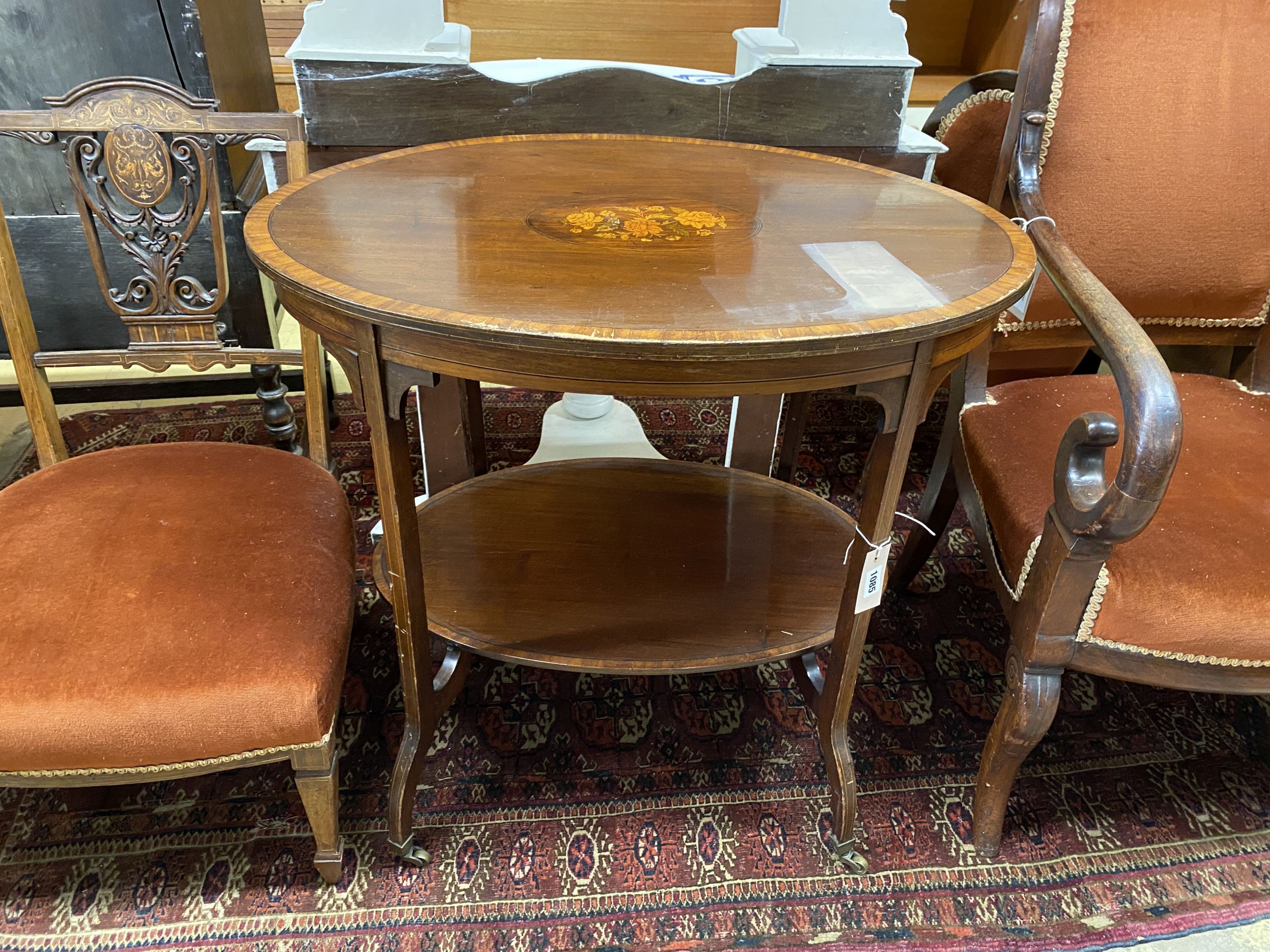 An Edwardian oval marquetry inlaid mahogany two tier occasional table, width 76cm, depth 54cm, height 69cm